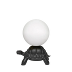 Turtle floor lamp with a glowing globe, in black