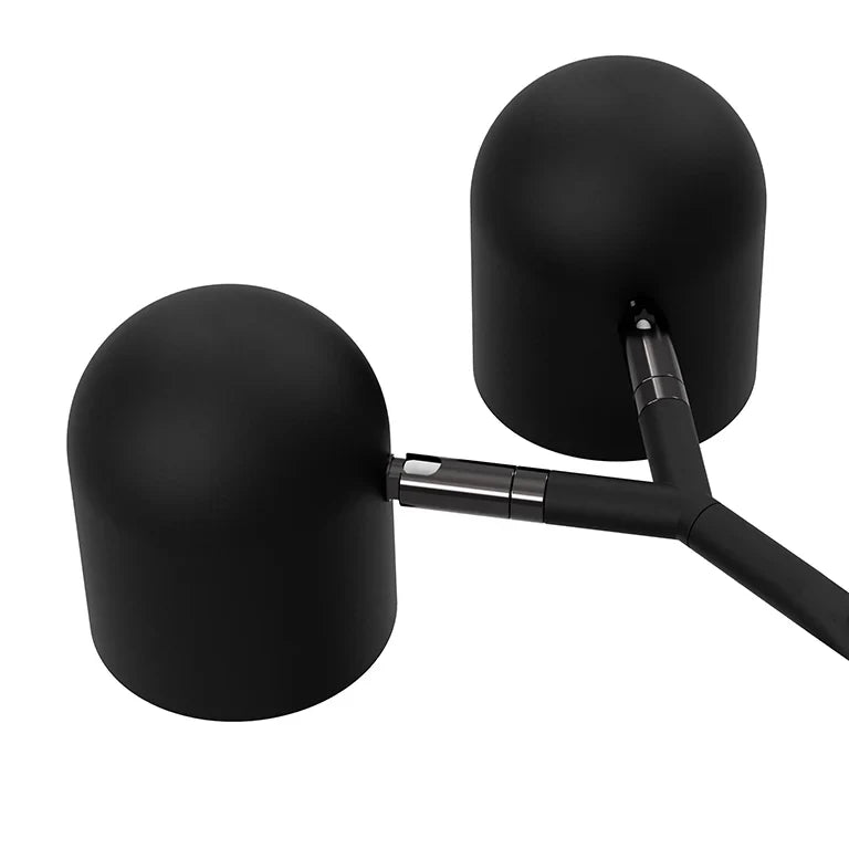 Twin-head adjustable floor lamp with a marble base, close-up of the two adjustable heads in black