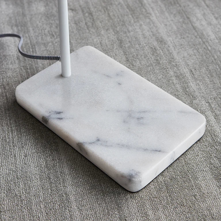 Twin-head adjustable table lamp, close-up of the white marble base