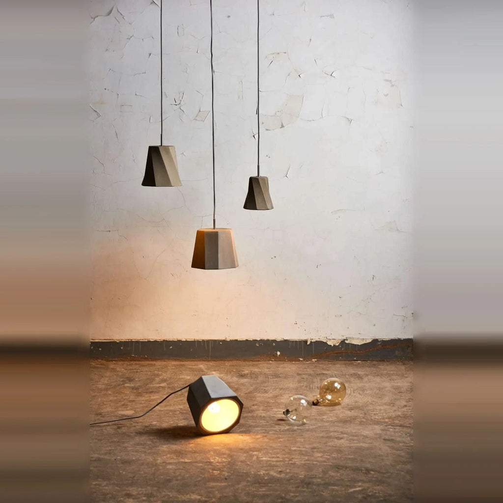 Twisted concrete pendant, a group with one shade on the floor
