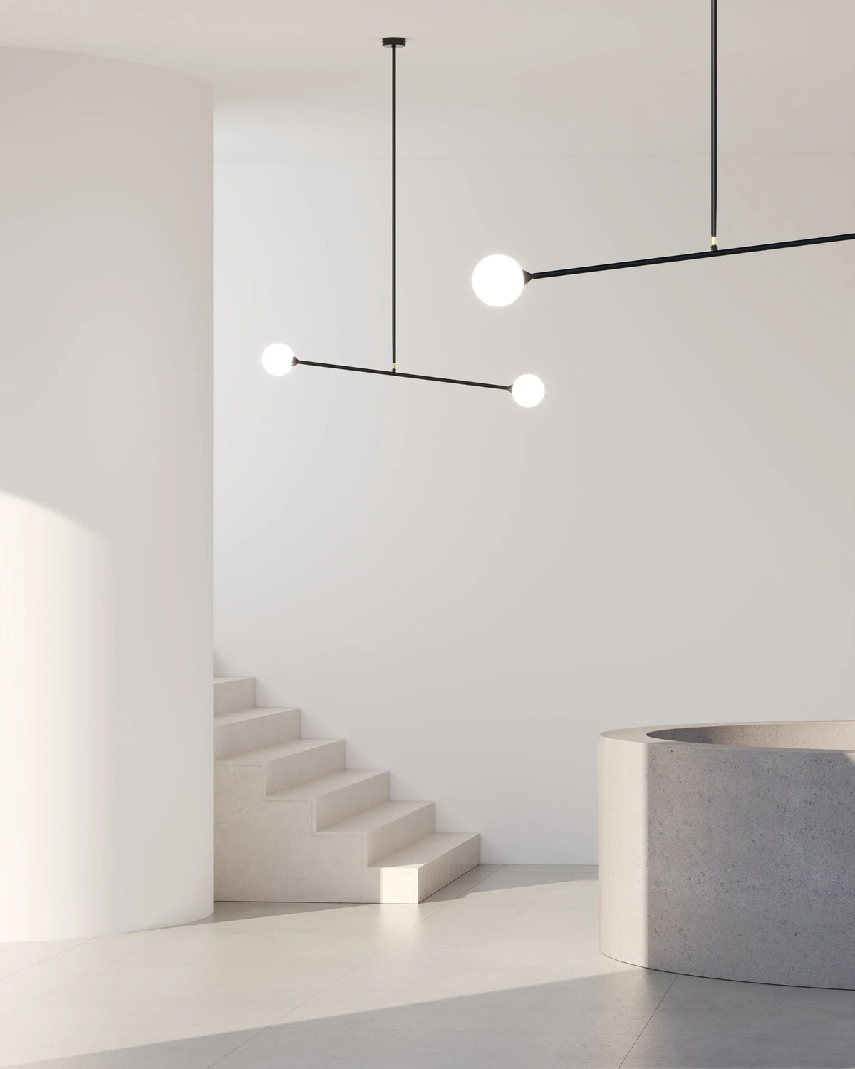Two-globe pendant with horizontal arm, in a pale stairwell