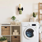 Two-tone up and down wall light, in beige and black in a utility room