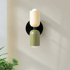 Two-tone up and down wall light, in beige and green, lit