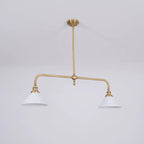 Two-light gold bar pendant with white cone shades, in a room