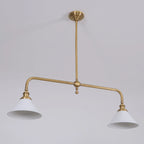 Two-light gold bar pendant with white cone shades, in a room