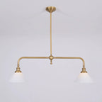 Two-light gold bar pendant with white cone shades, in a room