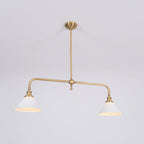 Two-light gold bar pendant with white cone shades, in a room