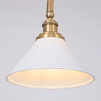 Two-light gold bar pendant with white cone shades, close-up of a shade