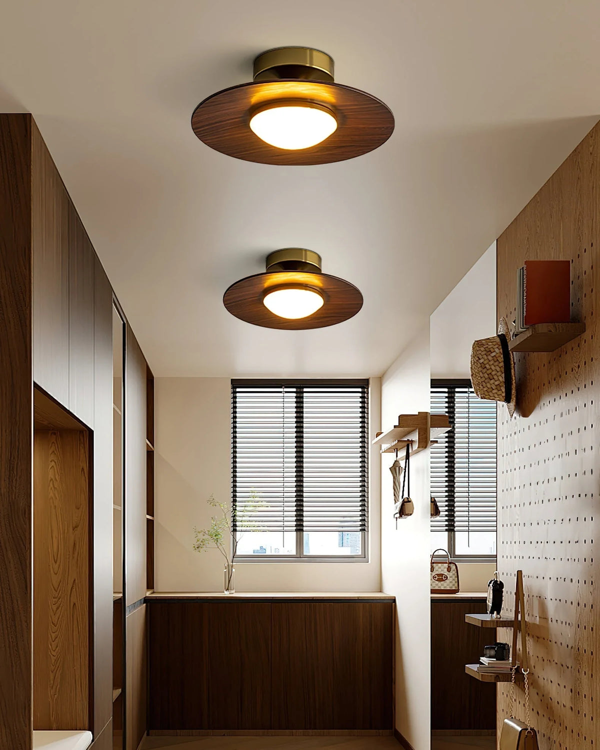 Low profile walnut and gold flush ceiling light, two lit along a hallway