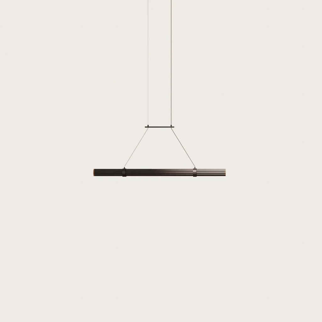 Walnut linear LED pendant, on a plain background