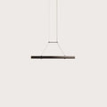 Walnut linear LED pendant, on a plain background