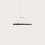 Walnut linear LED pendant, on a plain background