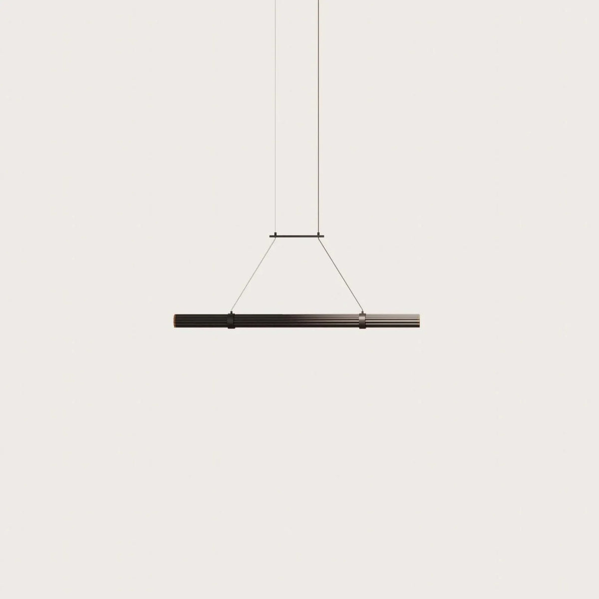 Walnut linear LED pendant, on a plain background
