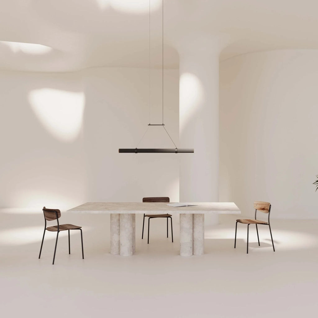 Walnut linear LED pendant, above a white dining table