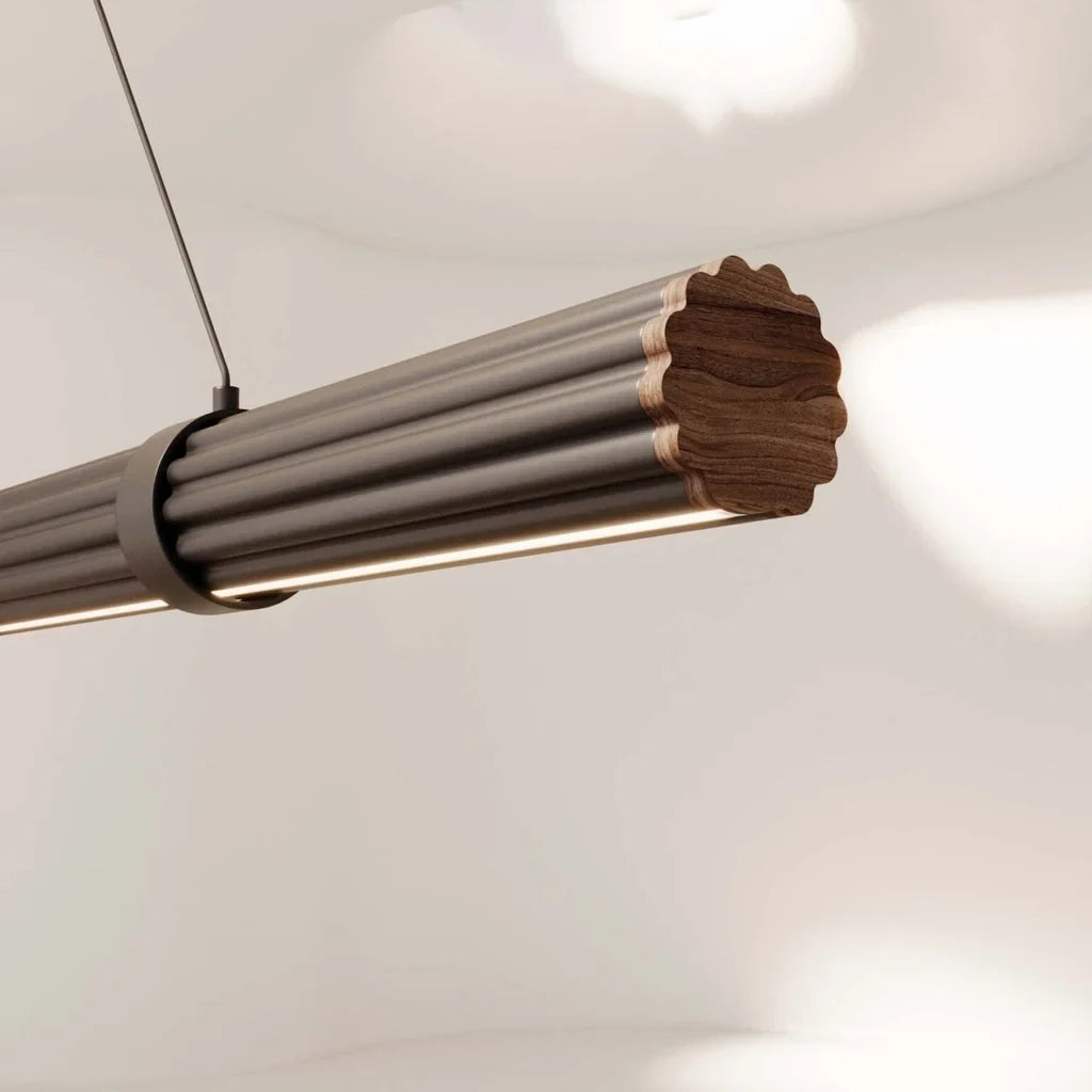 Walnut linear LED pendant, close-up of the walnut and metal end