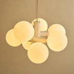 White steel globe cluster chandelier, detail of the steel cylinders and globes