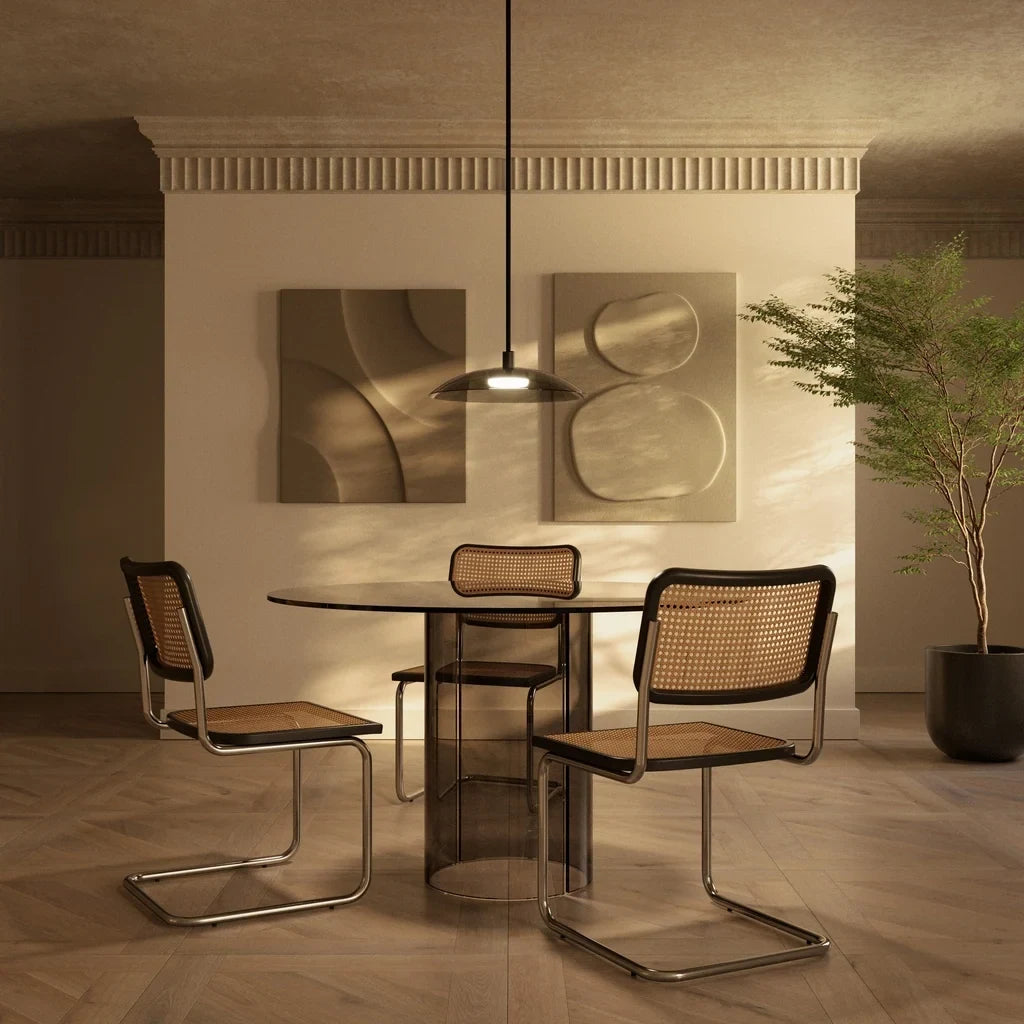 Wide glass disc LED pendant, above a round dining table