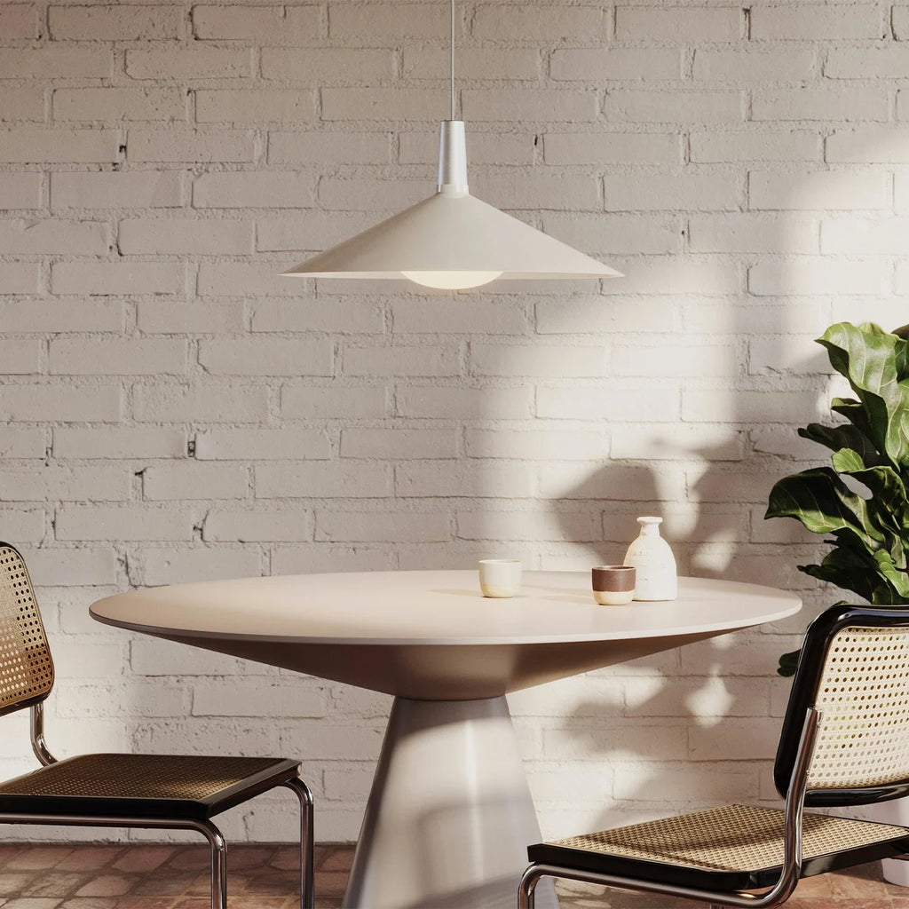 Large oyster white wide low-profile steel pendant, above a dining table