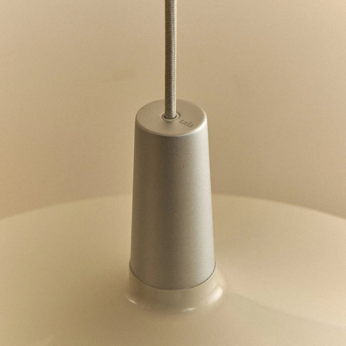 Large oyster white wide low-profile steel pendant, close-up of the holder and shade