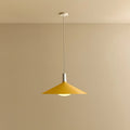 Large yellow wide steel pendant with oval bulb, against a plain wall