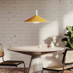Large yellow wide steel pendant with oval bulb, above a dining table