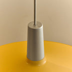 Large yellow wide steel pendant with oval bulb, close-up of the holder and shade