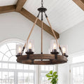 Wooden wheel chandelier with seeded glass shades, in a vaulted kitchen
