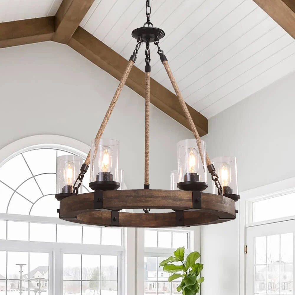 Wooden wheel chandelier with seeded glass shades, in a vaulted kitchen