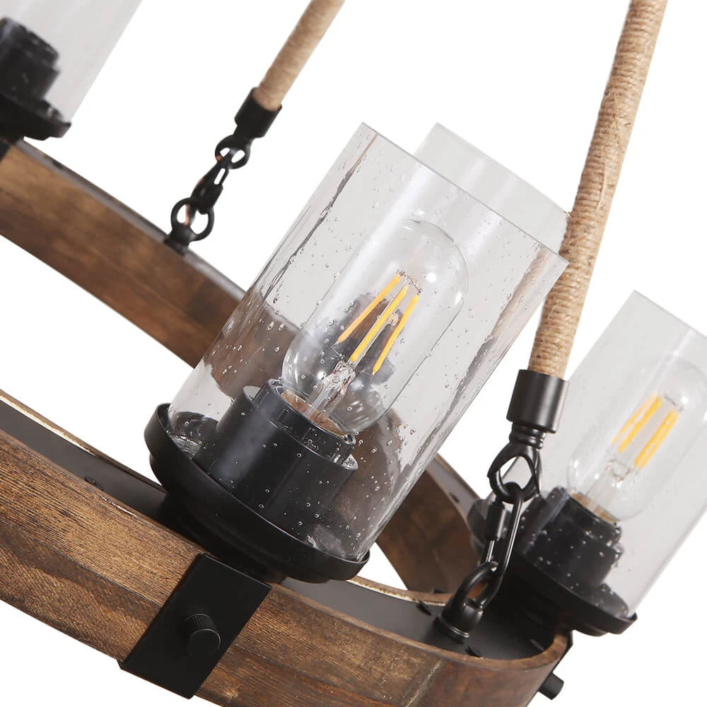 Wooden wheel chandelier with seeded glass shades, close-up of the seeded glass shades
