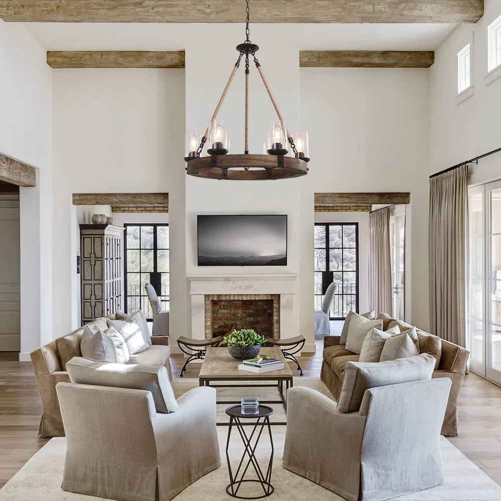 Wooden wheel chandelier with seeded glass shades, above a living room seating area