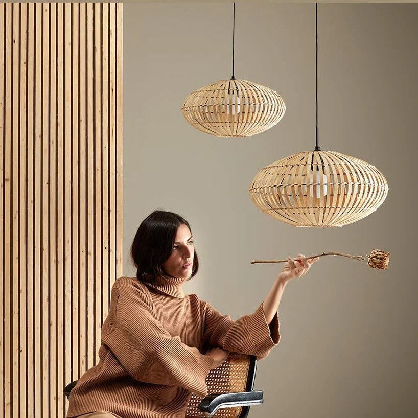 Woven bamboo oval pendant, hung at different heights in a living room