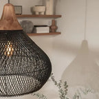 Woven rattan teardrop pendant light, in black, close-up
