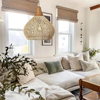 Woven rattan teardrop pendant light, in natural, in a living room