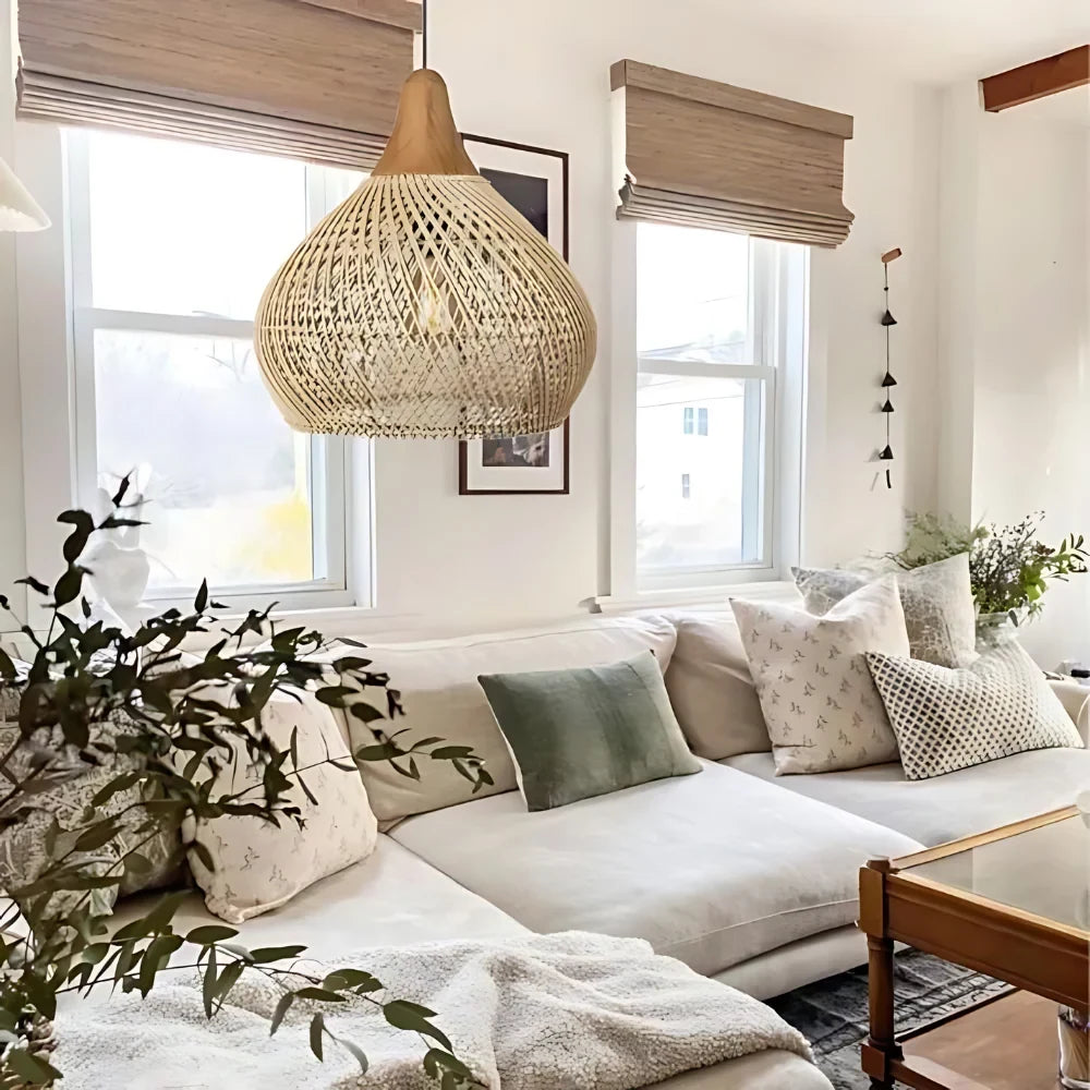 Woven rattan teardrop pendant light, in natural, in a living room