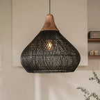 Woven rattan teardrop pendant light, in black, lit