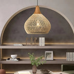 Woven rattan teardrop pendant light, in natural, in an alcove