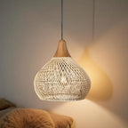Woven rattan teardrop pendant light, in natural, lit