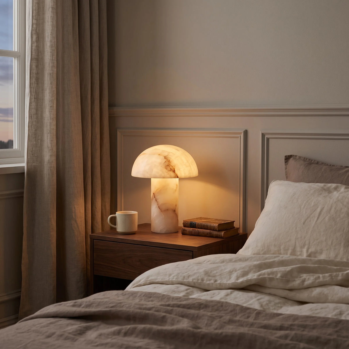 Alabaster bedside lamps glowing in a calm bedroom