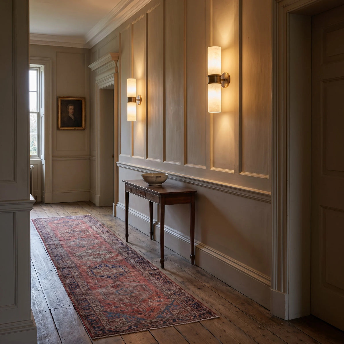 Alabaster wall lights along a hallway
